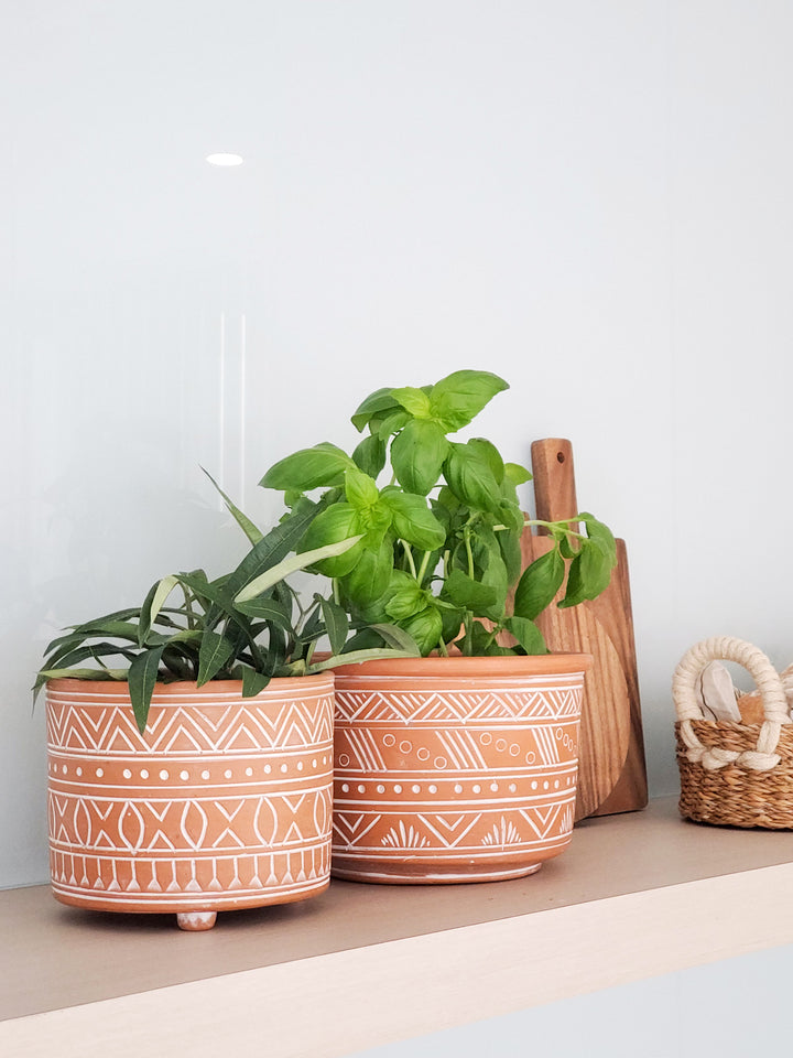 Handmade terracotta pots - small and large are artisan-inspired patterns that have been hand etched. A beautiful design of dynamic geometric patterns and hand-crafted from clay.