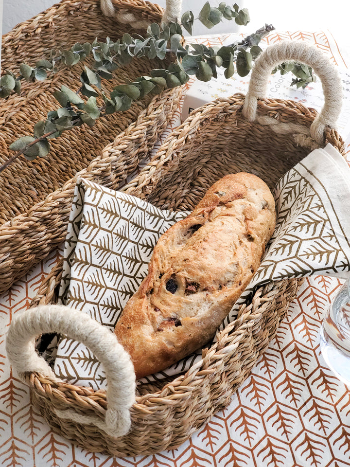 Serving bread baskets with hand screen printed tea towels in two colors on natural cotton.