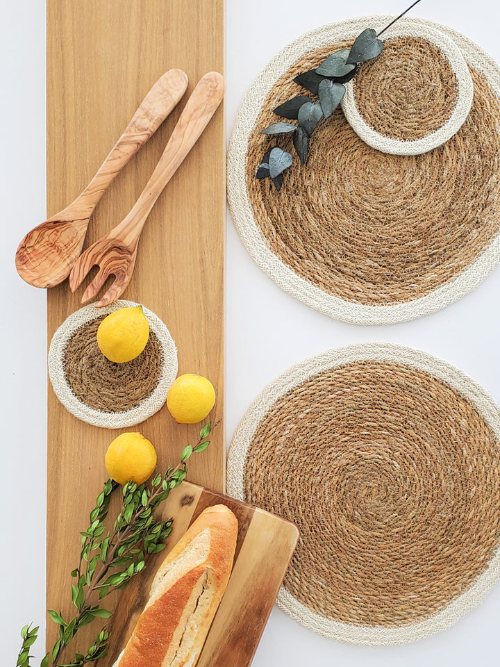 Natural textures and neutral color seagrass placemats, coasters and handcrafted wooden serving board